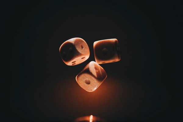 Wooden dice mid-tumble