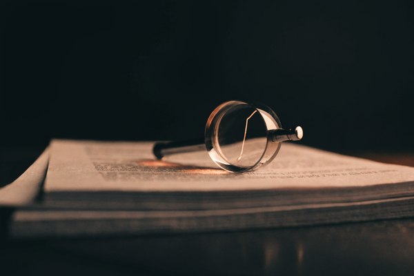 A loupe resting on documents